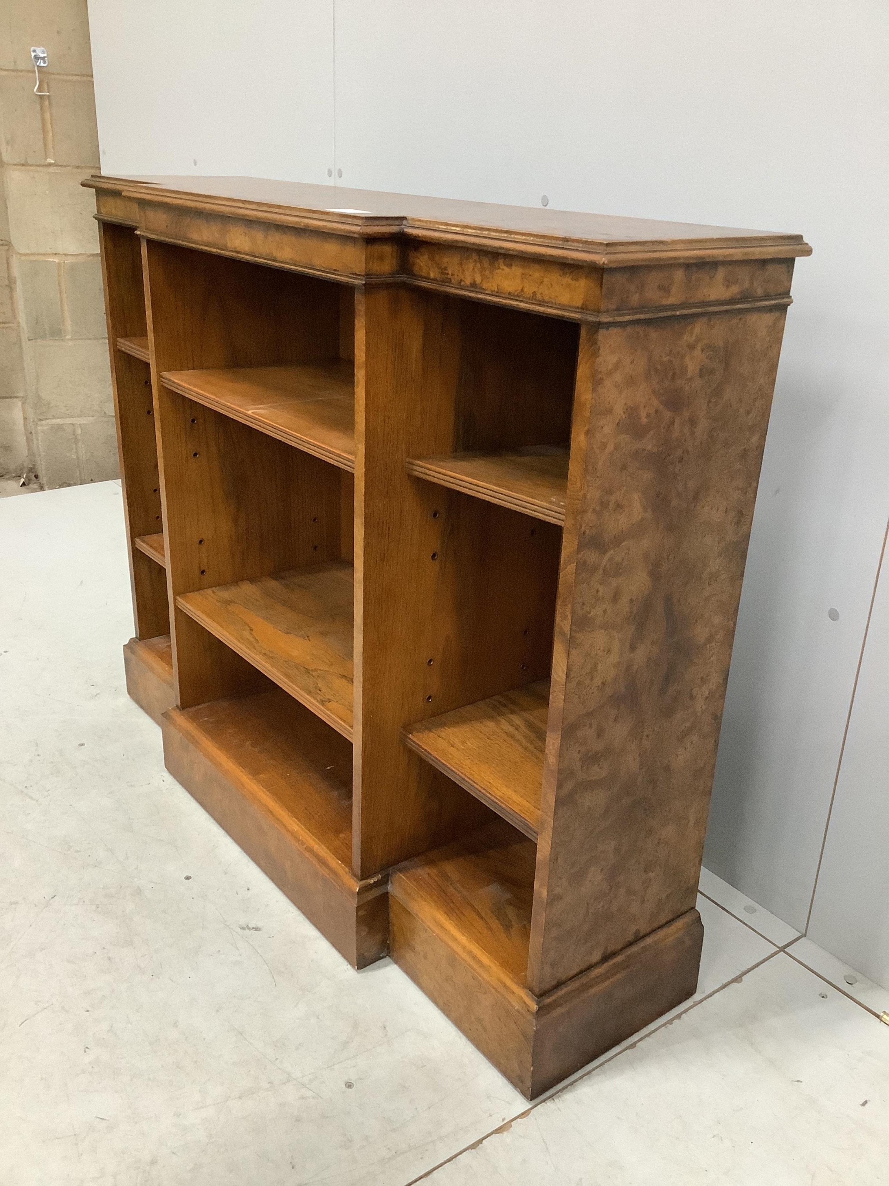 A Regency style banded burr elm dwarf breakfront bookcase, width 112cm, depth 32cm, height 91cm. Condition - good